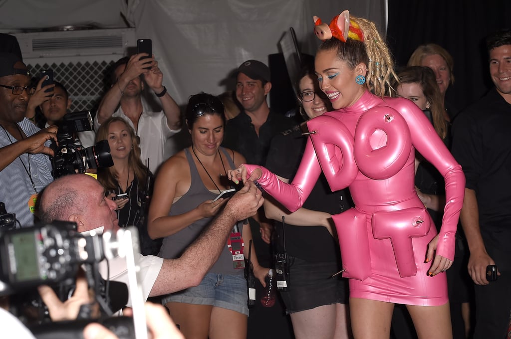 Miley Cyrus Shares a Joint With Photographers at VMAs