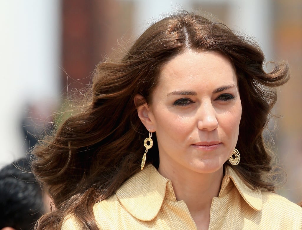 As she traveled to Bhutan, Kate's hair was down and parted in the middle. She kept her makeup light for daytime, but added her favorite eyeliner.