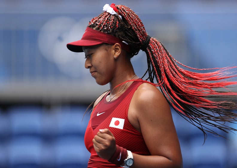 TOKYO, JAPAN - JULY 26: Naomi Osaka of Team Japan celebrates after match point in her Women's Singles Second Round match against Viktorija Golubic of Team Switzerland on day three of the Tokyo 2020 Olympic Games at Ariake Tennis Park on July 26, 2021 in T