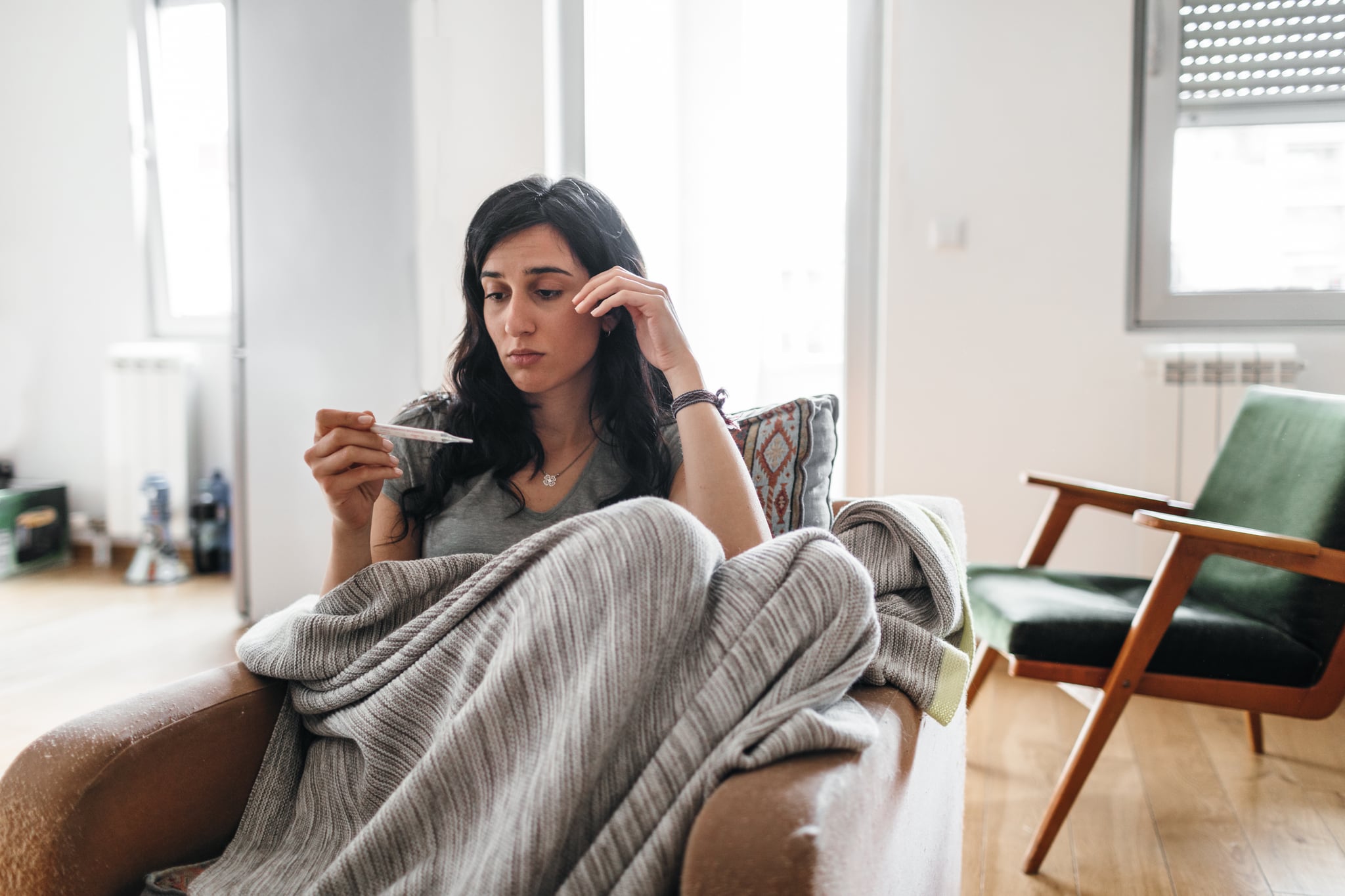 Young woman sick at home.