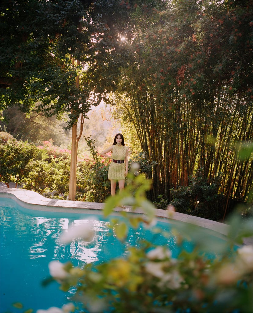 Now we're talkin'. This wide-angle shot gives us a better look at Selena's pool and the surrounding foliage. There are some pinkish-reddish flower bushes in the distance, and taller trees provide some shade from the California sun, making it feel like a secluded escape. We certainly wouldn't mind waking up to this view every morning!