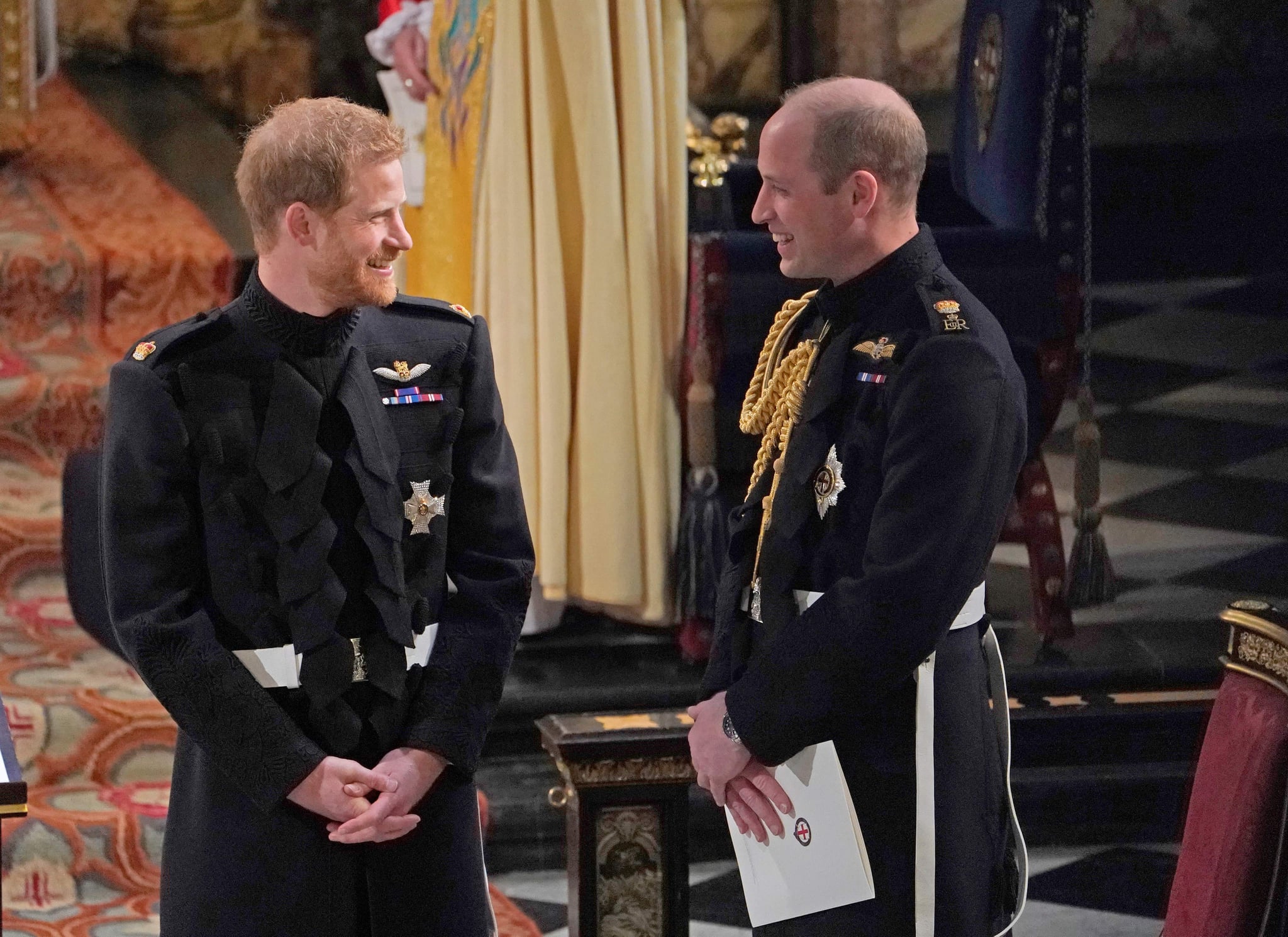 TOPSHOT - Britain's Prince Harry, Duke of Sussex (L) and Prince Harry's brother and best man Prince William, Duke of Cambridge wait in the chapel ahead of his wedding to US actress Meghan Markle at St George's Chapel, Windsor Castle, in Windsor, on May 19, 2018. (Photo by Owen Humphreys / POOL / AFP)        (Photo credit should read OWEN HUMPHREYS/AFP/Getty Images)