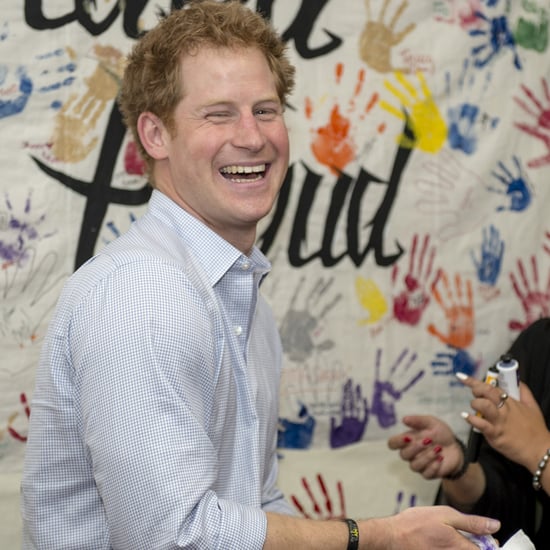 Prince Harry Puts Purple Handprint on Photographer's Head
