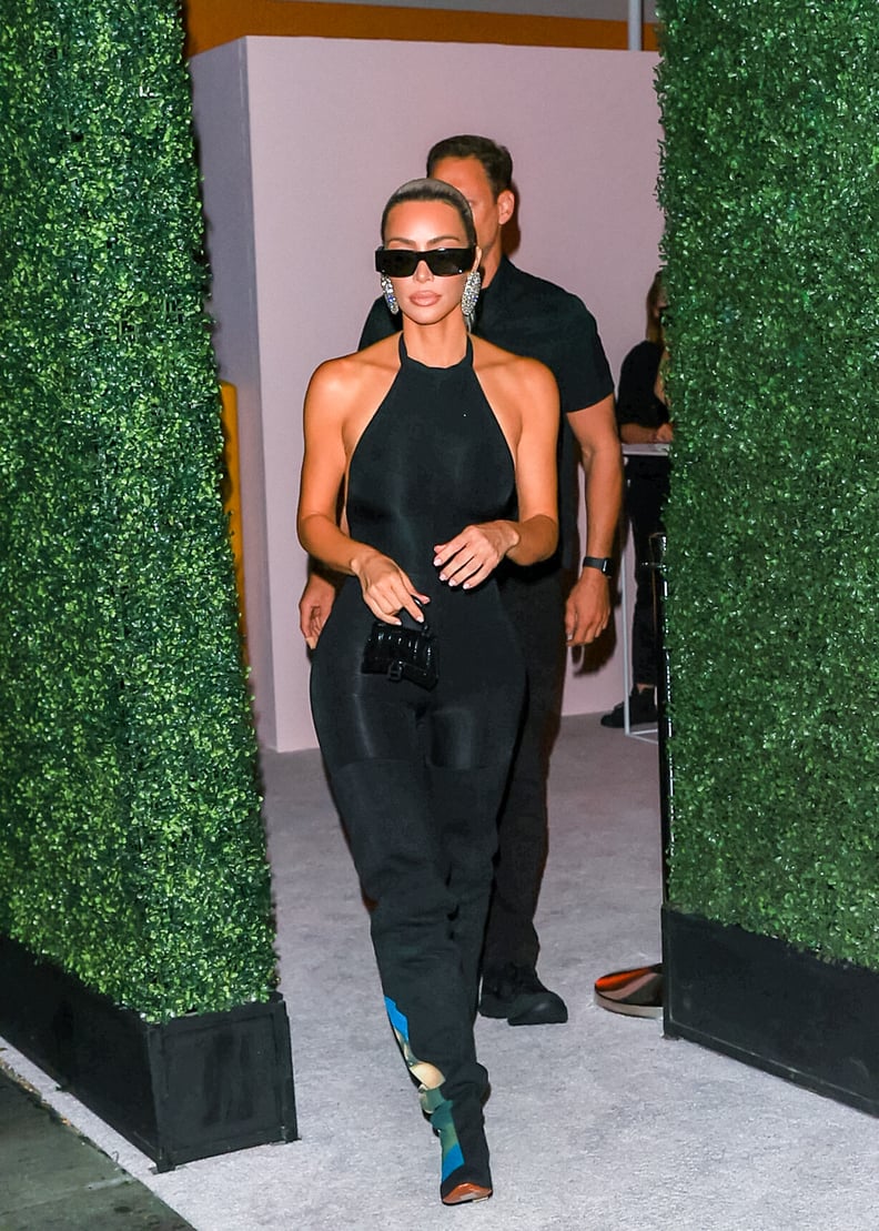 Kim Kardashian's Black Jumpsuit and Thigh-High Boots Photos