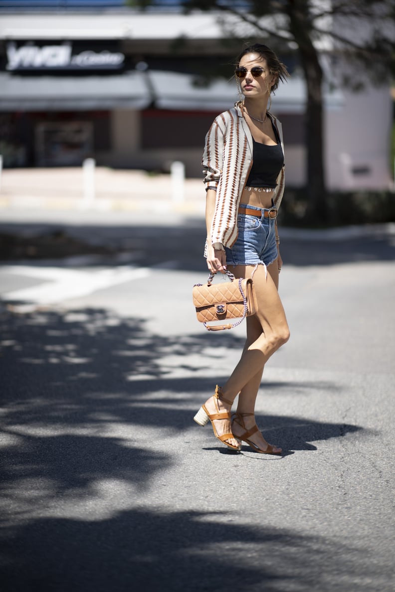 She Layered a Patterned Button-Up Shirt on Top