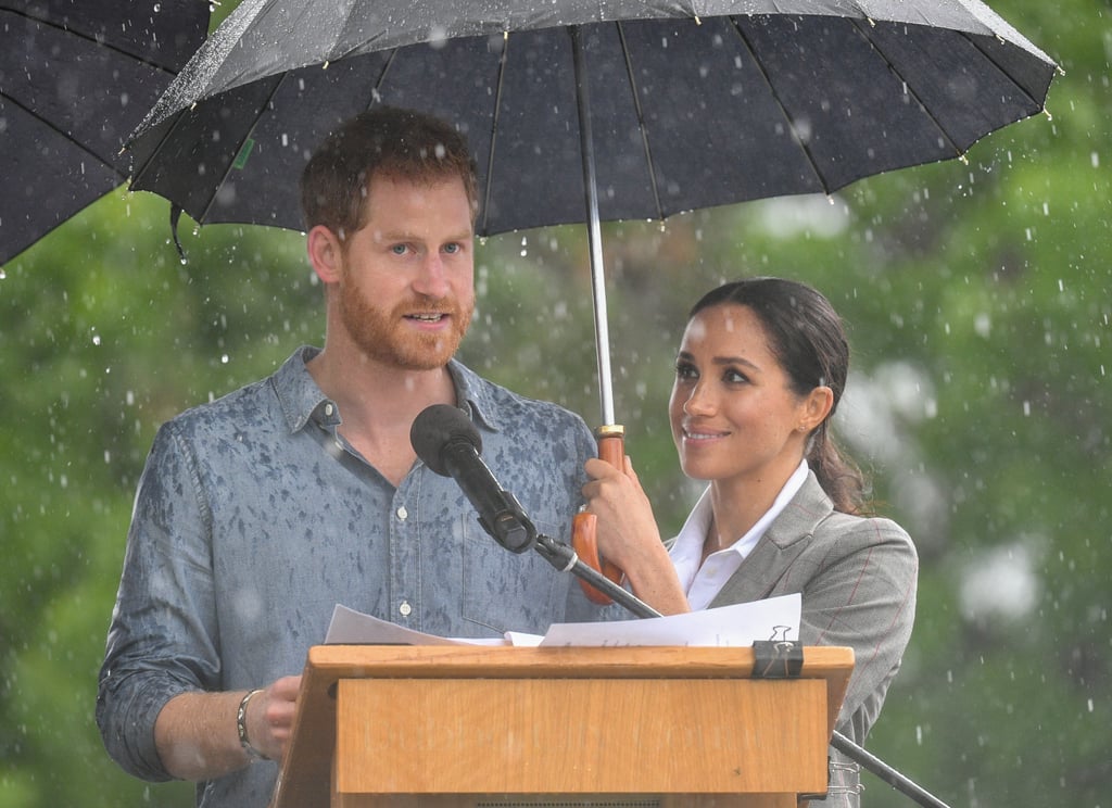 Meghan Markle Holding Prince Harry's Umbrella
