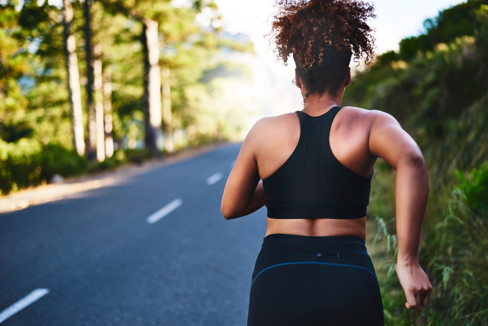 Rearview shot of a young woman out for her morning run