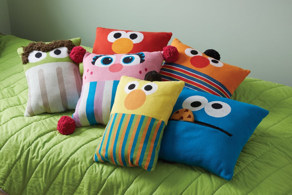 Oscar the Grouch Knit Throw Pillow ($49), Elmo Knit Throw Pillow ($49), Abby Cadabby Knit Throw Pillow ($49), Ernie Knit Throw Pillow ($49), Bert Knit Throw Pillow ($49), and Cookie Monster Knit Throw Pillow ($49)