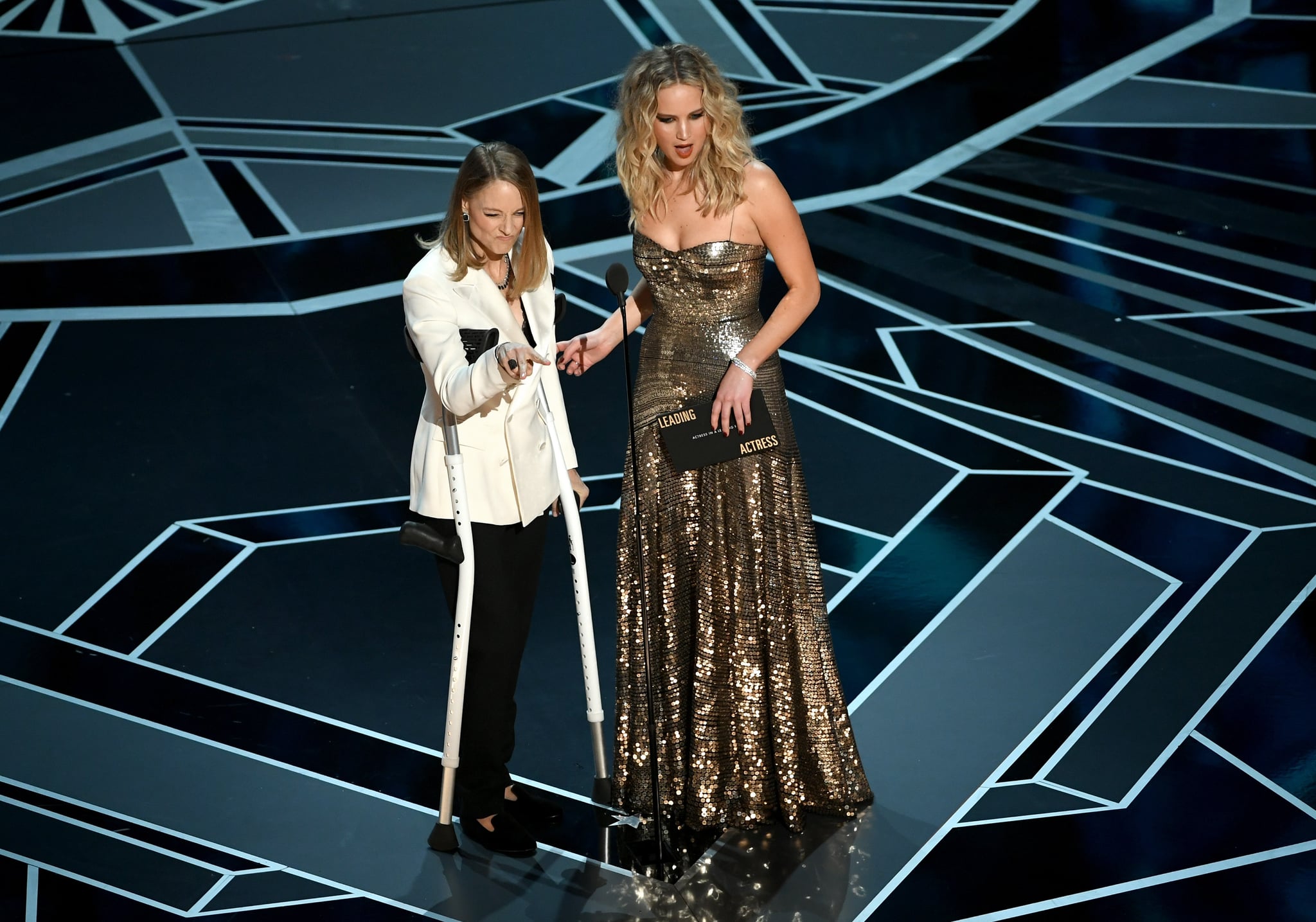 HOLLYWOOD, CA - MARCH 04:  Actors Jodie Foster (L) and Jennifer Lawrence speak onstage during the 90th Annual Academy Awards at the Dolby Theatre at Hollywood & Highland centre on March 4, 2018 in Hollywood, California.  (Photo by Kevin Winter/Getty Images)