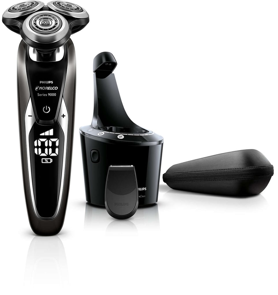 This is that splurge-worthy product he didn’t realize he needed until you so kindly replaced his $20 manual razor with it. The device has three shaving heads (yes, three) that each move independently from one another following every last contour, nook, and cranny of the face. It finds even more hairs than a basic razor and cuts them even closer to the skin, so his face remains extra smooth for twice as long. The large digital display screen makes it feel more like a fun gadget (almost like a robot!) than a grooming tool. It even comes with its own cleaning system that cleans, lubricates, dries, and charges it after each use — one less thing for him to think about.
Philips Norelco Shaver 9700 /S9721/84 ($350)
