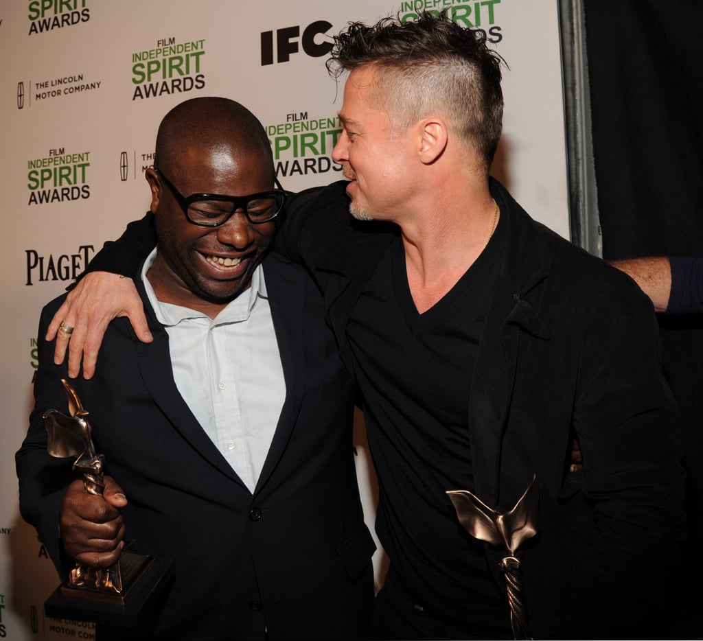 Brad Pitt wrapped his arm around director Steve McQueen after they both picked up Spirit Awards.
