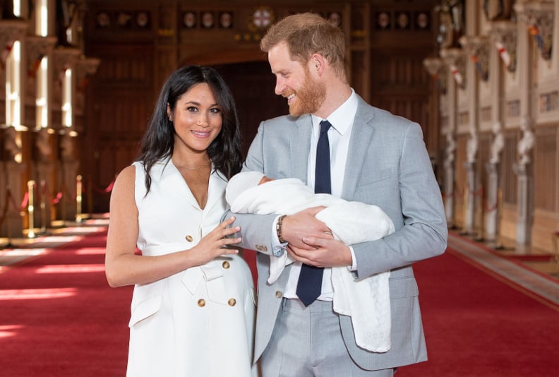 Britain's Prince Harry, Duke of Sussex (R), and his wife Meghan, Duchess of Sussex, pose for a photo with their newborn baby son, Archie Harrison Mountbatten-Windsor, in St George's Hall at Windsor Castle in Windsor, west of London on May 8, 2019. (Photo 