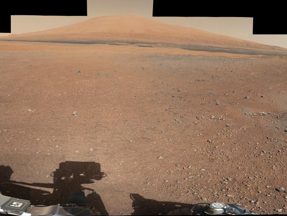 Here's the landing site of the Curiosity rover with Mount Sharp in the background.
Source: NASA Here's the landing site of the Curiosity rover with Mount Sharp in the background.
Source: NASA