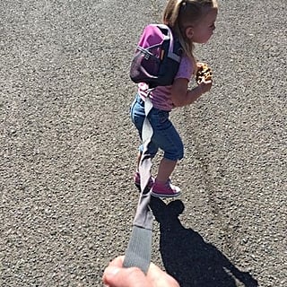 The Relatable Reason This Dad Puts His Kid on a Leash