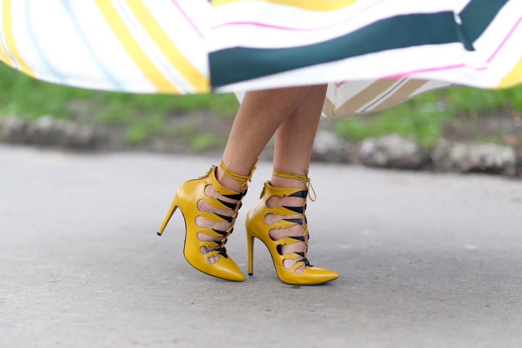 Her totally on-trend lace-up heels also packed a bright color punch.