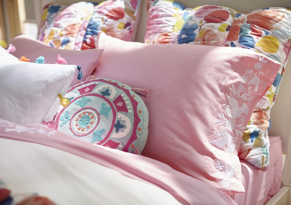 PS Moms: What do each of your bedrooms look like?
Lennon: I like a boho hippie vibe and have always decorated with that in mind.
Maisy: I’ve always loved bright colors, so my room always ends up colorful. Our rooms are filled with the items from our PBteen line now!
Products pictured: Bohemian Blooms Quilt + Sham ($36-$219), Bohemian Medallion Pillow ($35), Tassel Pop Duvet Cover + Sham ($33-$169), Enchanted Cuff Sheet Set ($33-$139)