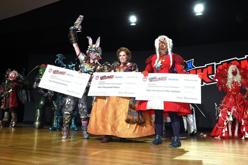 NEW YORK, NEW YORK - OCTOBER 09: Cosplayers pose with their prizes during the Cosplay Central Crown Championships at NYCC during Day 3 of New York Comic Con 2021 at Jacob Javits Center on October 09, 2021 in New York City. (Photo by Bryan Bedder/Getty Ima