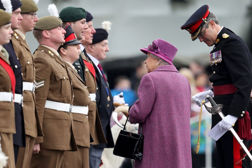 The queen looks up to members of The Royal Welsh.