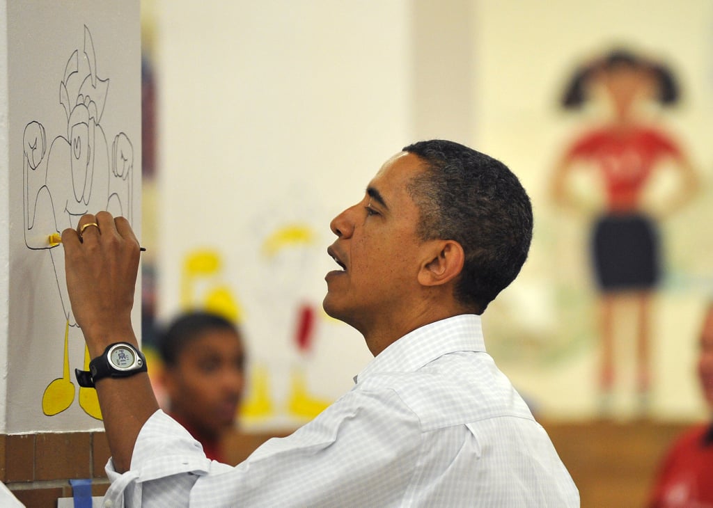 Painting a mural at a DC middle school in 2011.