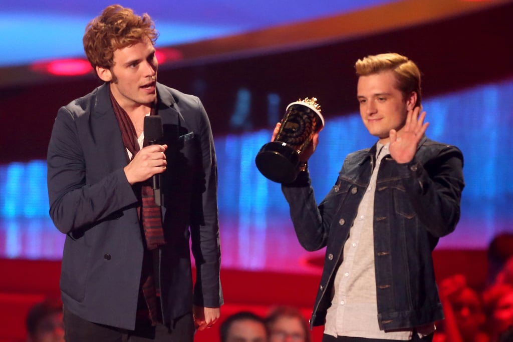 Catching Fire's Sam Claflin took over the microphone as Josh Hutcherson raised the roof while accepting the best movie award.
