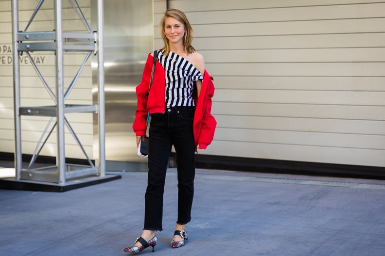 Underneath a Red Bomber Coat With Dark Jeans