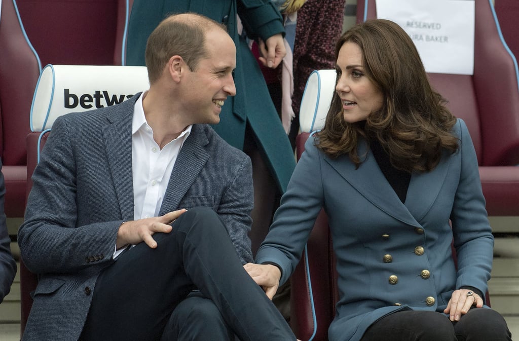 Kate placed her hand on William's leg as they chatted during a ceremony in October 2017.