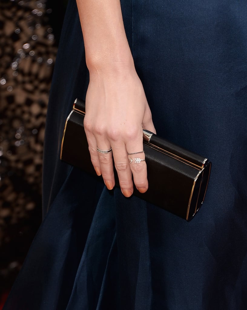Amber Heard kept the colors dark with a black Versace clutch to accompany her navy gown.
Amber Heard kept the colors dark with a black Versace clutch to accompany her navy gown.