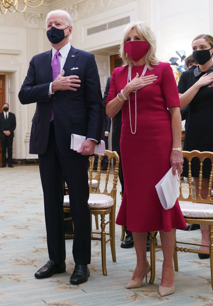 Biden wearing Brandon Maxwell's red sheath with a fluted hem, coordinated with a matching Gigi Burris face mask, for the virtual Presidential Inaugural Prayer Service on Jan. 21, 2021.