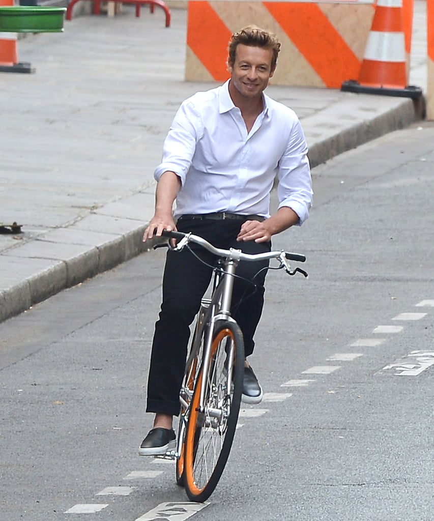 Simon Baker rode a bike around Paris on Monday while filming a Givenchy commercial.
