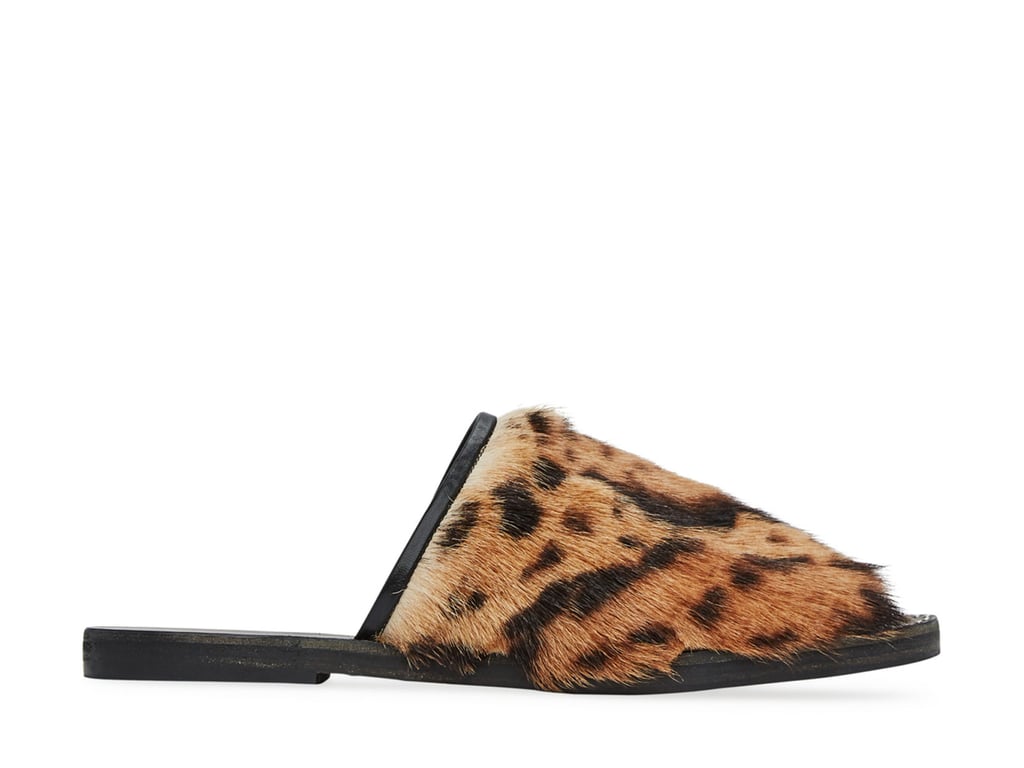 "If you're looking for your first pair of slides, I'd suggest checking out these furry leopard ones from Freda Salvador ($315). They're intense yet wearable, and I know they'll give my outfits a style boost." — ML