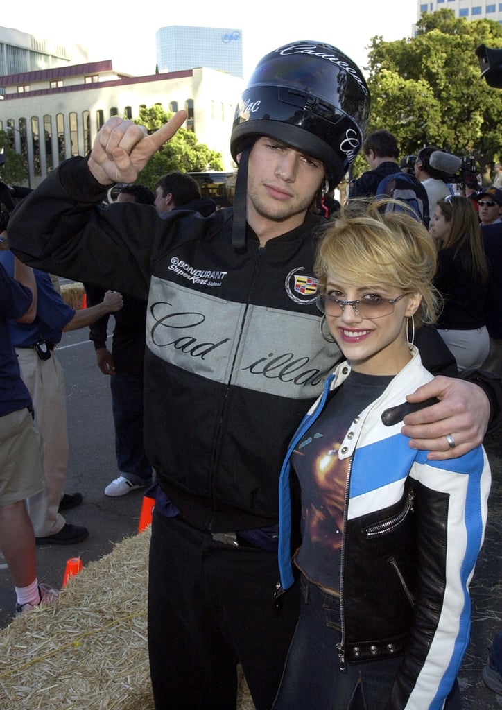 Ashton Kutcher and Brittany Murphy posed at the Cadillac Grand Prix party in 2003.