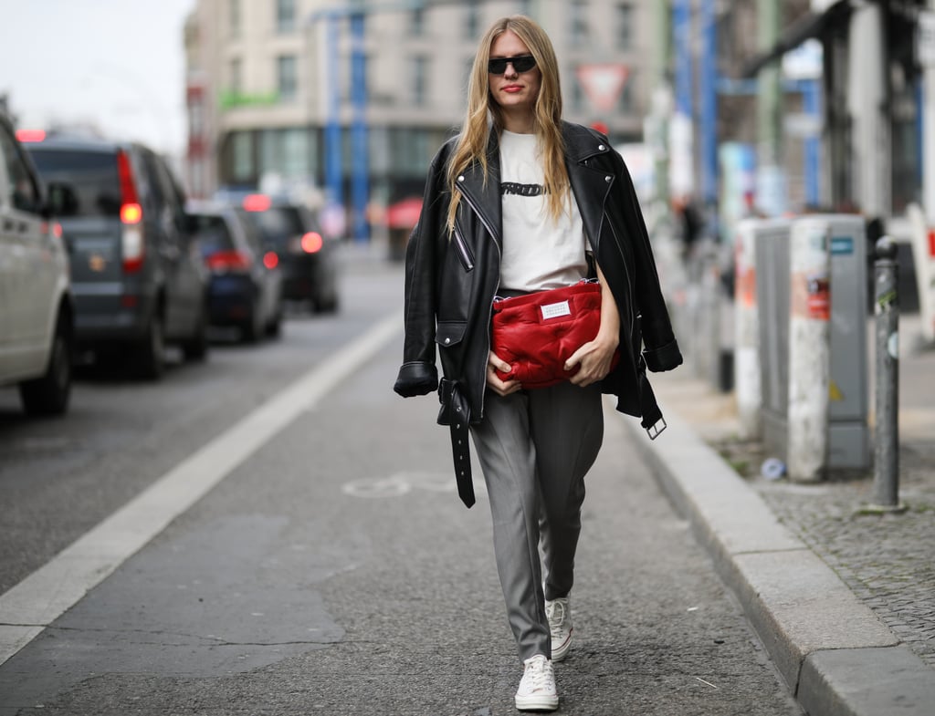 Wear your leather jacket over your shoulders and style it with a white tee and slacks.