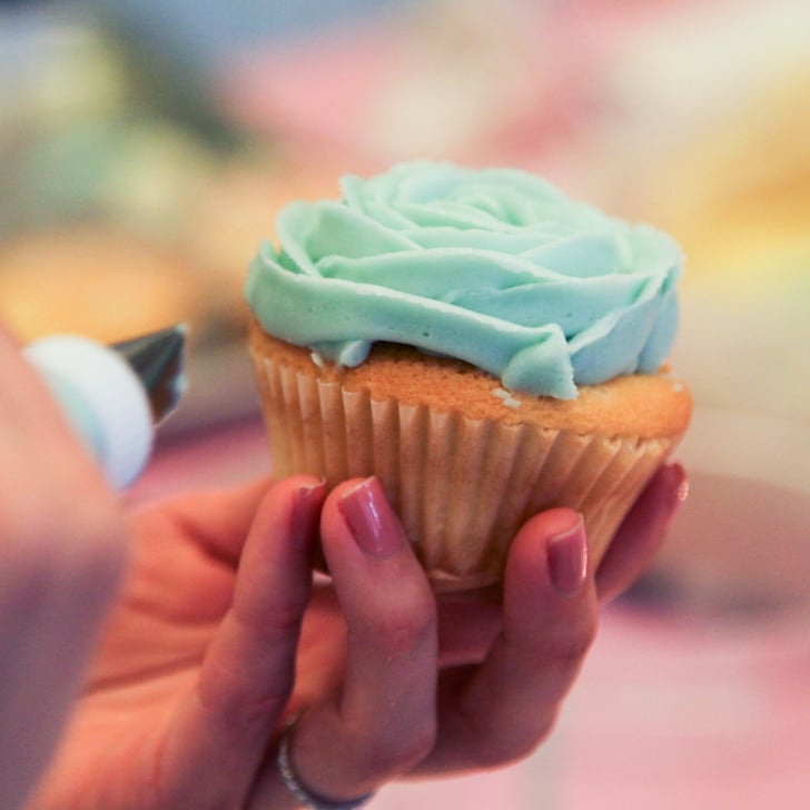 Finish Piping on Frosting How to Frost Cupcakes Like a Rose