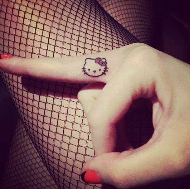 Small and cute Hello Kitty cartoon tattoos
