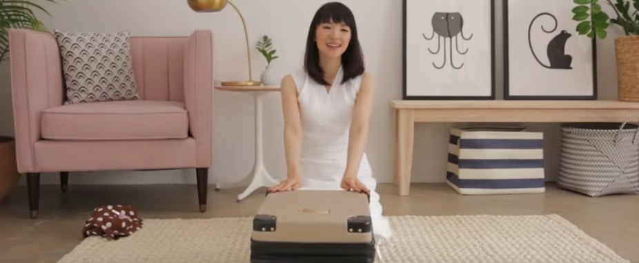 Marie Kondo Packing a Suitcase