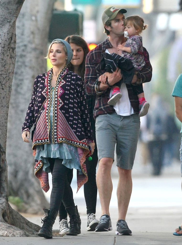 Chris kissed India while walking with Elsa.