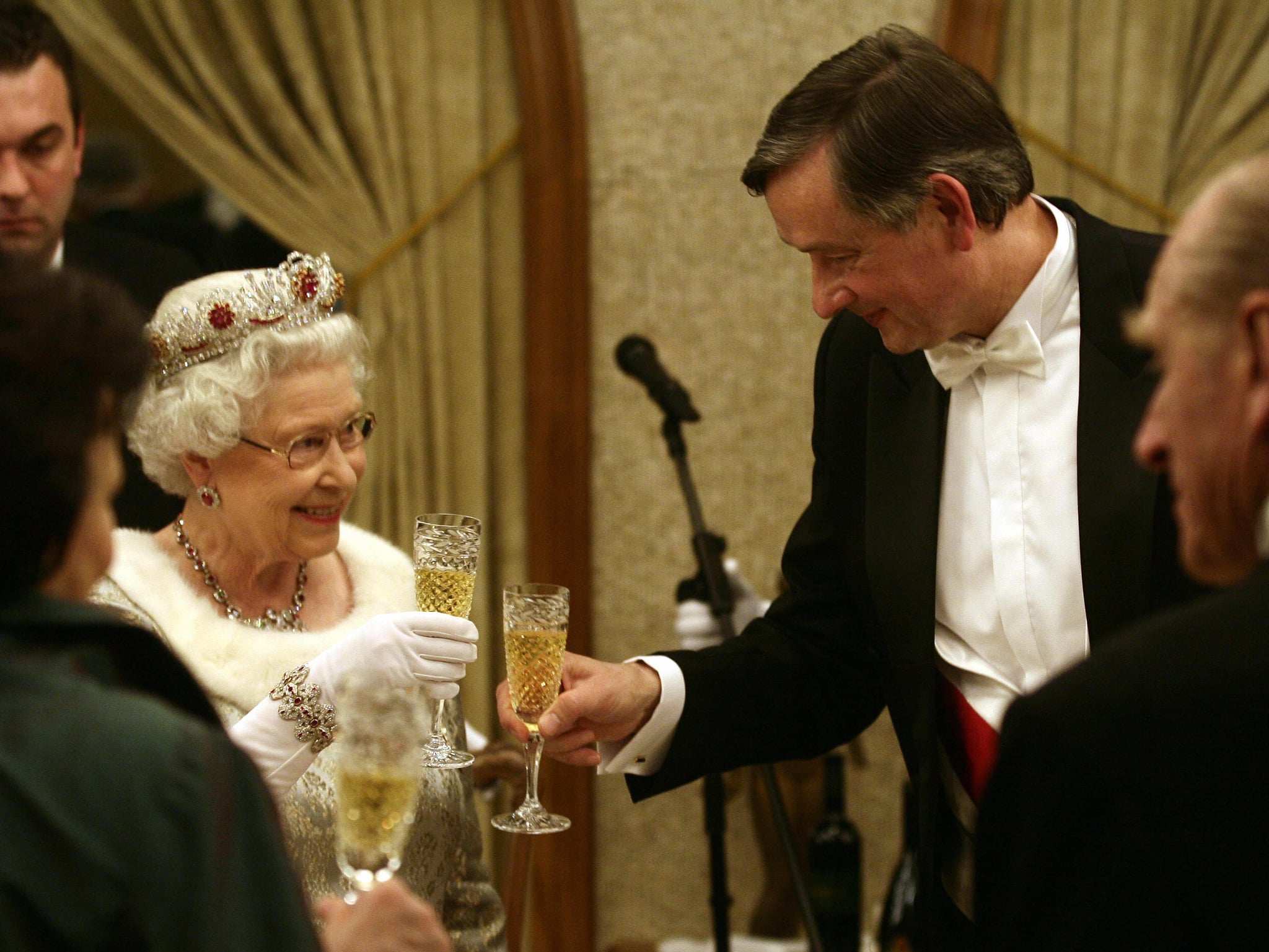 Britain's Queen Elizabeth (L) shares a glass of wine with Slovenia's President Danilo Turk (R) during a dinner at Brdo Castle on October 21, 2008. Queen Elizabeth and Prince Philip are on a two-day official visit to Slovenia. AFP PHOTO Srdjan Zivulovic/pool (Photo credit should read SRDJAN ZIVULOVIC/AFP/Getty Images)