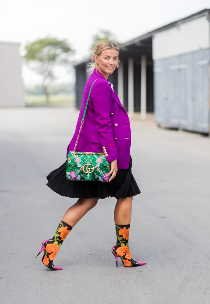Put on a pleated skirt with a blazer in an eye-catching color, then match your patterned accessories.