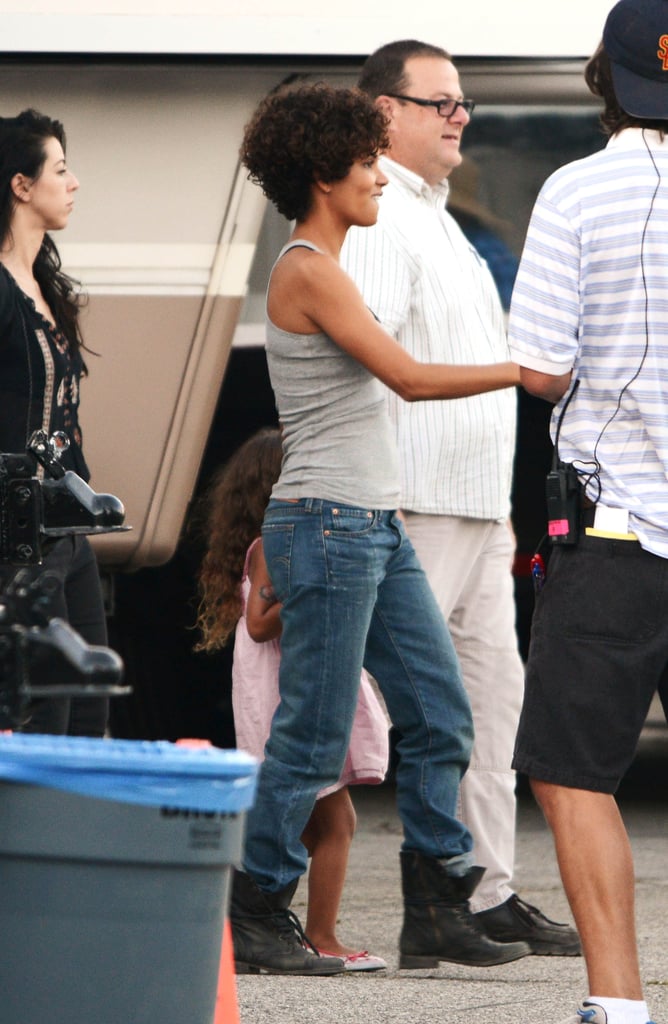 A gorgeous curly cut, slouchy boyfriend jeans, and worker boots . . . And she still evokes the most flawlessly stylish finish.