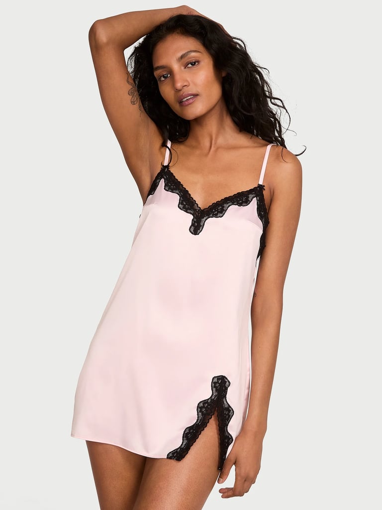 Victoria's Secret Tease Satin Lace-Trim Mini Slip Dress ($20, originally $50)
I'm kicking off the new year with a little romance by adding this slip to my lingerie collection — while it's sixty percent off. Loved by Selena Gomez, the gorgeous baby-pink style features black lace trim along the neckline and slit. The satin fabric is soft to the touch and the adjustable straps ensure a comfortable fit. 
Editor Quote: "This comfy slip dress gets more wear out of me than I expected: I put it on around the house and style it for date night with black sheer tights and a blazer." — Jessica Andrews, senior style director