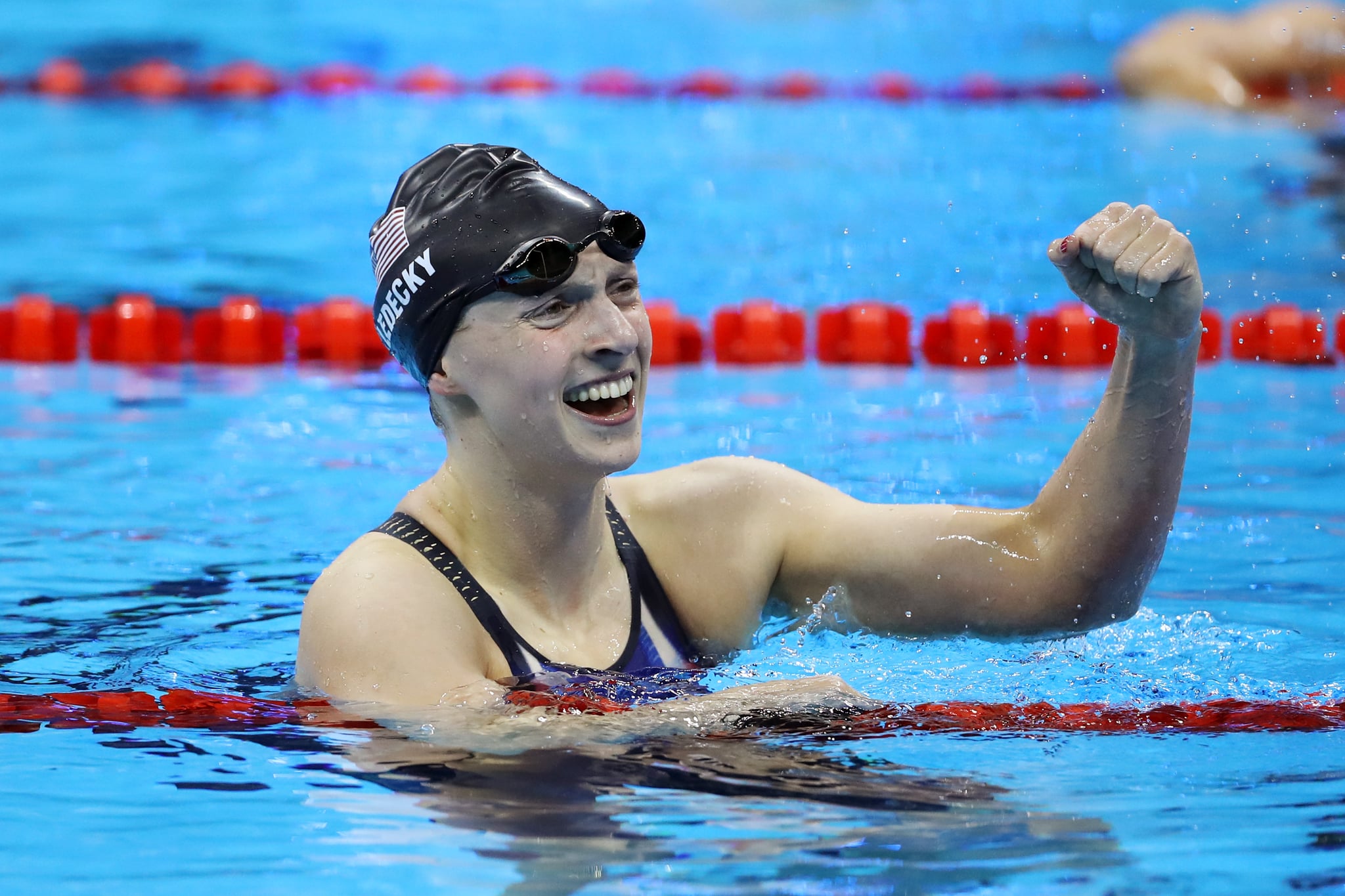 RIO DE JANEIRO, BRAZIL - AUGUST 09:  Katie Ledecky of the United States celebrates winning gold in the Women's 200m Freestyle Final on Day 4 of the Rio 2016 Olympic Games at the Olympic Aquatics Stadium on August 9, 2016 in Rio de Janeiro, Brazil.  (Photo by Al Bello/Getty Images)