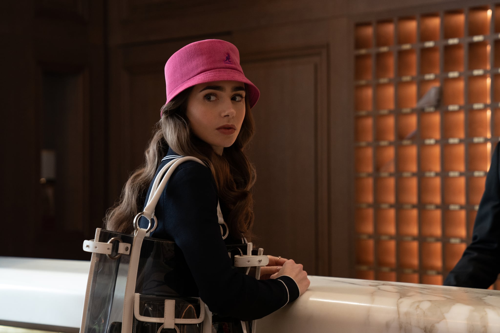 EMILY IN PARIS (L to R) LILY COLLINS as EMILY in episode 107 of EMILY IN PARIS Cr. STEPHANIE BRANCHU/NETFLIX  2020