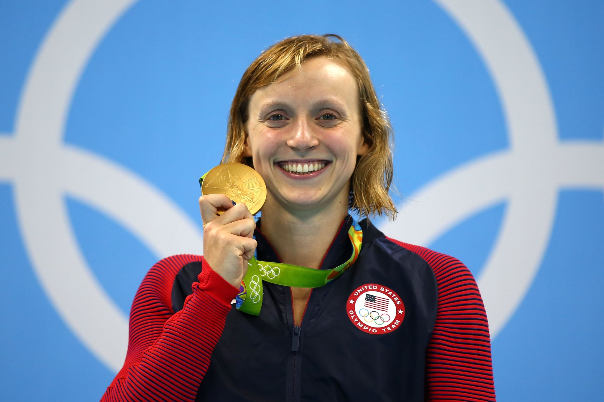 RIO DE JANEIRO, BRAZIL - AUGUST 12:  Katie Ledecky of United States celebrates on the podium after winning gold in the Women's 800m Freestyle Final on Day 7 of the Rio 2016 Olympic Games at the Olympic Aquatics Stadium on August 12, 2016 in Rio de Janeiro, Brazil.  (Photo by Clive Rose/Getty Images)