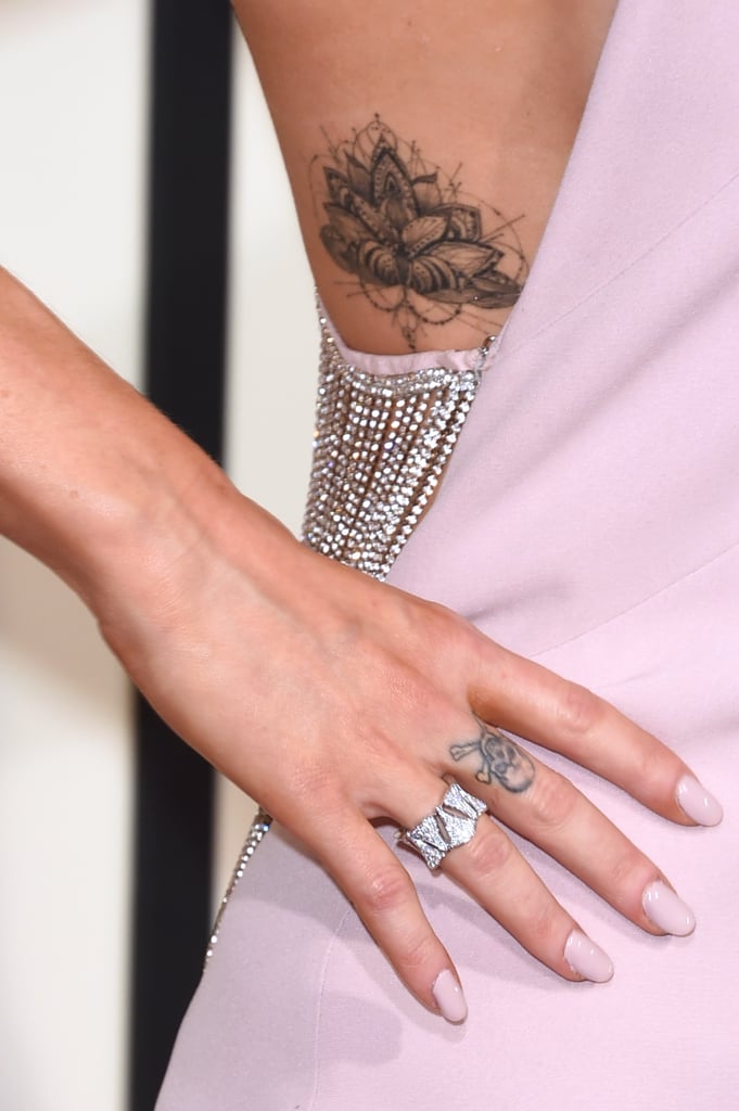 Wearing a Bulgari ring.