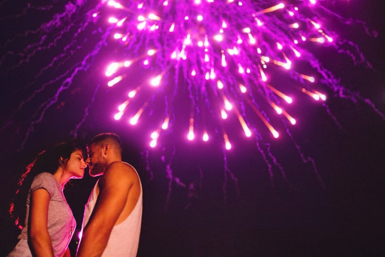 Kiss under fireworks.