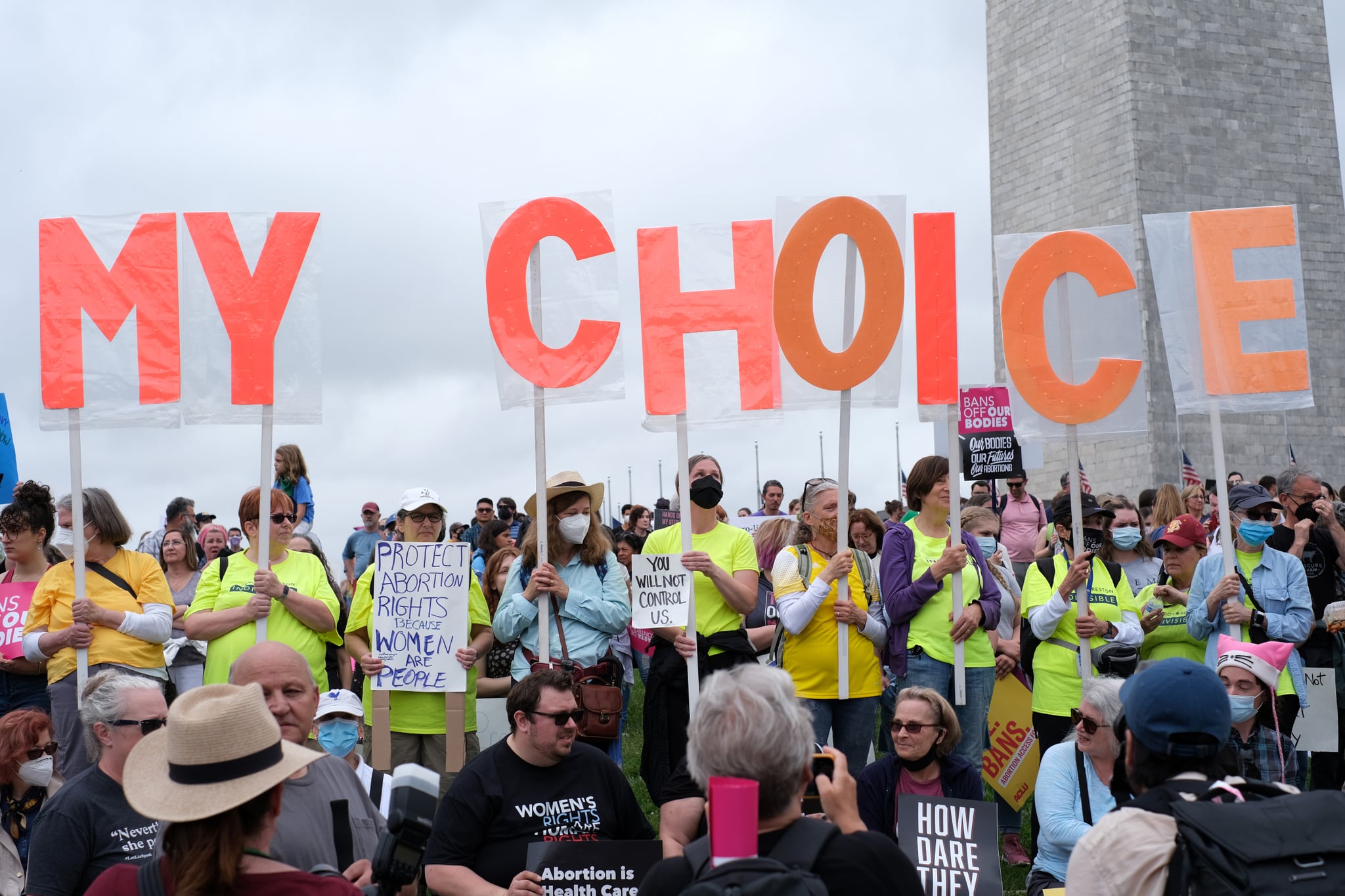 WASHINGTON, DISTRICT OF COLUMBIA, UNITED STATES - 2022/05/14: Abortion rights demonstrators holding sign as they gather near the Washington Monument during a nationwide rally in support of abortion rights in Washington, D.C. Abortion rights supporters are holding rallies across the country urging lawmakers to codify abortion rights into law after the leaked Supreme Court opinion suggesting the possibility of overturning the Roe v. Wade abortion rights decision. (Photo by Probal Rashid/LightRocket via Getty Images)