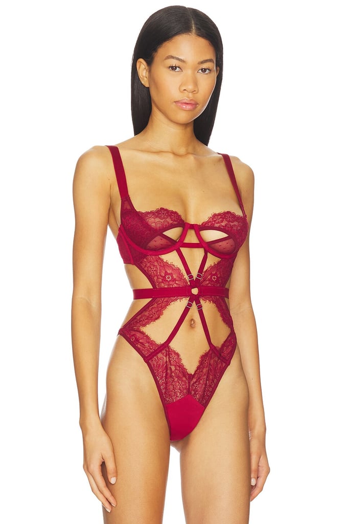 Thistle and Spire Minna Playsuit ($118)
If you're more of a one-piece person, this intricate lace design with hook closures has adjustable straps and is comfortably lightweight. The ruby shade is right on-trend for this time of year, though you can also shop it in black and white — so you've got options.