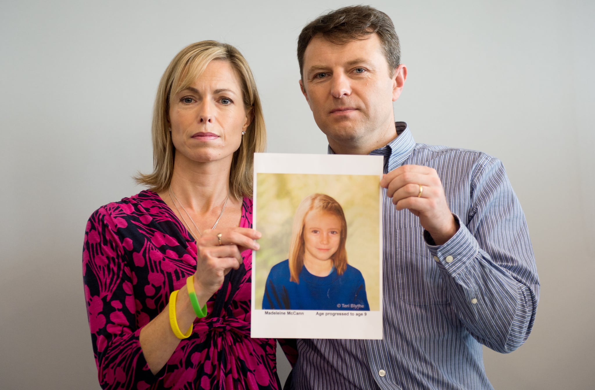 Parents of missing girl Madeleine McCann, Kate (L) and Gerry McCann (R) pose with an artist's impression of how their daughter might look now at the age of nine ahead of a press conference in central London on May 2, 2012 five years after Madeleine's disappearance while on a family holiday in Portugal.  Aged three at the time, the artist's impression depicts how Madeleine may now look, based on family photos of her, along with childhood images of her parents.  AFP PHOTO / LEON NEAL        (Photo credit should read LEON NEAL/AFP/GettyImages)