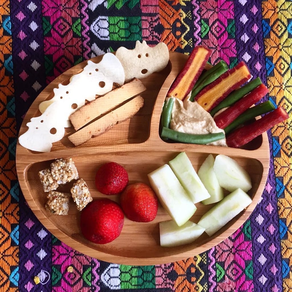 "Lunch: purple heirloom carrots and green beans with plain hummus, apples, strawberries, almond quinoa bites, BBQ-smoked tofu sticks and 'boo' chips."
