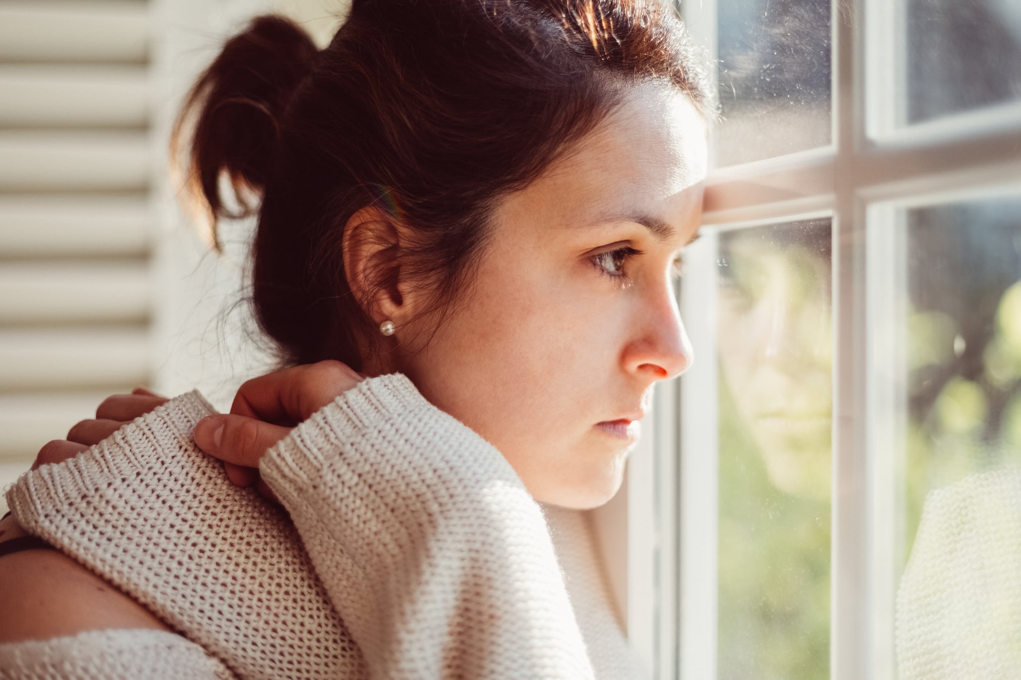 Thoughtful woman at home - copyspace